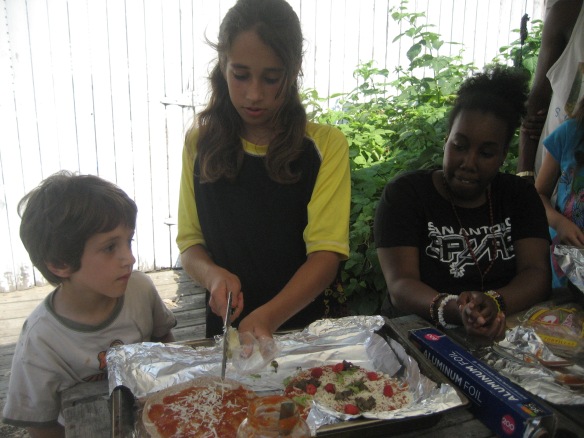 The kids picked herbs and other foods growing in the Children's Garden to add to their pizzas.